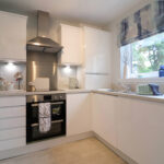 Showhome interior fitted kitchen with a stylish gloss finish
